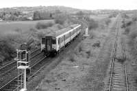 150258 passes the future site of Dunfermline Queen Margaret Station in April 1992.  On the right is the stump of the Dunfermline Upper/Kincardine Junction line. [See image 9816]<br><br>[Bill Roberton 15/04/1992]