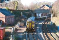 156512 is about to pass below St Mary's Street bridge and draw to a halt at Dumfries platform 1 on 3 March 2014. The train is the 13.22 Newcastle Central - Glasgow Central.<br><br>[John Furnevel 03/03/2014]