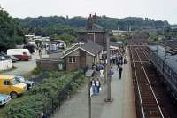 August Bank Holiday Monday 1978 finds Thorpe le Soken the focus of much human activity, not all of it train related. The approach road hosts a special holiday market. Locals attracted by the event wait to return down the line to Clacton/Walton, most having been less than enthused by a few racks of not so special secondhand clothes and an ice cream van.<br><br>[Mark Dufton 28/08/1978]