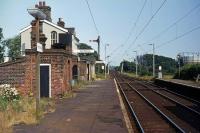 The down platform at Kirby Cross, looking east towards Frinton and Walton-on-Naze on 11th July 1976. Passenger business on the branch was very good that summer as many sought to escape the exceptional inland heat and drought with days at the seaside. The already parched vegetation on the platform would not see normal rainfall for another two months. <br><br>[Mark Dufton 11/07/1976]
