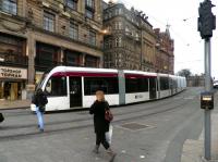 A tram turns off Princes Street into South St Andrew Street on 6 March heading for St Andrew Square.<br><br>[John Yellowlees 06/03/2014]