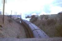 Polmadie standard class 4 tank 80086 climbs away from Busby towards Thorntonhall on 4 April 1966 with the 17.33 St Enoch - East Kilbride service. <br><br>[G W Robin 04/04/1966]