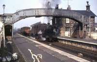 A southbound freight passes through Auchinleck station on 2 April 1965. The locomotive is Dumfries based Black 5 no 44723. <br><br>[John Robin 02/04/1965]