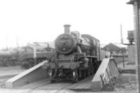 Busy scene in the shed yard at 89A Oswestry on 8 August 1960. The locomotive on the turntable is one of the depot's Ivatt 2-6-0s no 46514.<br><br>[David Stewart 08/08/1960]