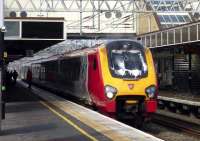 <I>Just a quick wash and we'll be off...</I>  A London [Euston] bound Virgin Voyager about to depart from Milton Keynes Central on 8 March 2014.<br><br>[John Steven 08/03/2014]