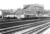 31158 brings empty stock from Old Oak carriage sidings past Ranelagh Bridge fuelling point on the approach to Paddington in 1982. Locomotive 50049, stabled behind the tankers on the left, will soon take out this stock on what will be its diagrammed return working to Plymouth.<br><br>[John Furnevel 22/01/1982]