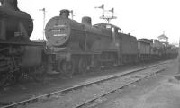 Fowler 2P 4-4-0 no 40581 is one of a number of redundant steam locomotives stored awaiting disposal in the sidings alongside Royston shed in September 1960. Disposal in this case took place at Doncaster Works the following month.<br><br>[K A Gray 24/09/1960]
