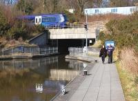 The south portal of Roughcastle Tunnel on the Union/Forth & Clyde Canal link in March 2014, with a westbound 170 passing on the E & G route.<br><br>[Bill Roberton 11/03/2014]