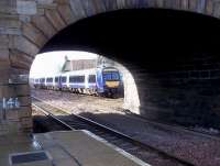 Seen through the South Road bridge, Turbostar 170408, forming the 09.00 from Edinburgh Waverley, rolls into Cupar on a bright and sunny Monday morning on 10 March on its way to Dundee.<br><br>[Andrew Wilson 10/03/2014]