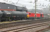 <I>Over the top</I>. DBS 60024 and 13 loaded bitumen tankers take the steep descent towards Preston Docks on 14 March. This view is from the south end of Platform 3 at Preston station.<br><br>[Mark Bartlett 14/03/2014]