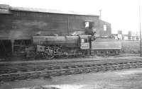 Crab 2-6-0 no 42741 alongside the coaling stage at Hurlford shed in April 1962.<br><br>[David Stewart 17/04/1962]