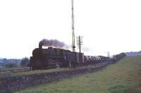 A standard class 5 4-6-0 brings a northbound freight past Busby Junction in August 1965.<br><br>[G W Robin /08/1965]