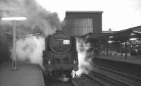 BR Standard class 9F 2-10-0 no 92009 waits to leave Carlisle on the evening of 26 March 1967 with <I>Scottish Rambler no 6</I> bound for Glasgow Central via Dumfries and Kilmarnock. <br><br>[K A Gray 26/03/1967]