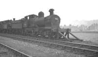 Dukedog 4-4-0 no 9018 out of use in the sidings alongside Oswestry shed in the spring of 1960. The locomotive was cut up at Swindon Works in August that year.<br><br>[K A Gray 21/05/1960]