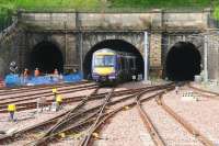 The Mound tunnels viewed from Waverley in September 2007, with wires present only in the north portal. Preparatory work is underway to electrify the others. The 0915 DMU ex-Glasgow Queen Street is ambivalent about the whole thing.<br><br>[John Furnevel 06/09/2007]