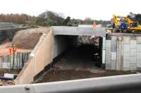 The Borders Railway bridge/tunnel at Sheriffhall on 28 March 2014, seen from a car westbound on the diverted section of the Edinburgh city bypass towards Sheriffhall roundabout (eventually). Some infill has now been carried out in preparation for restoration of the original road.<br><br>[F Furnevel 28/03/2014]