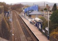 Although services on the Copy Pit line are suspended during the relining of Holme Tunnel, Burnley Manchester Road station remains open as a temporary terminus for services from Blackpool North. Viewed from Manchester Road on 20 March 2014, the construction of the new station building and station concourse are well advanced although the wooden platforms remain [see image 28696].<br><br>[John McIntyre 20/03/2014]