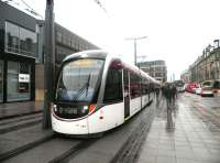 An Edinburgh tram on test standing alongside Haymarket station on 31 March 2014.<br><br>[John Yellowlees 31/03/2014]