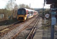 A service from Ilkley takes the Bradford Forster Square line at Shipley. Alongside unit 333016 the Skipton line trails in from the right and beyond that is the connection into the yard. This facility has a resident diesel shunter and still generates regular trains of scrap metal to Cardiff. <br><br>[Mark Bartlett 24/03/2014]