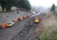 Looking south east towards Kilnknowe Junction on 31 March from Kilnknowe Place road bridge, Galashiels. The Waverley and Peebles lines ran in parallel at this point [see image 28518]. The bridge carrying Plumtreehall Brae over the trackbed can just be made out through the fog in the background.<br><br>[John Furnevel 31/03/2014]