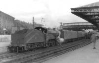 40670 about to remove the empty stock of the 3.40pm ex-Stranraer from a sunny Dumfries station on 5 September 1961. [See image 46460]  <br><br>[David Stewart 05/09/1961]