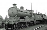 Caley Bogie 54502 on Polmadie shed in the summer of 1962. Withdrawn from Dumfries in September that year the locomotive spent a period 'stored' at Carstairs [see image 38047] before being cut up in the yard of Messrs McWilliams, Shettleston, in September 1963.<br><br>[John Robin 20/07/1962]