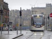 Tram 265 climbs up South St Andrew Street on 3 April having just turned off Princes Street. Edinburgh's Old Town forms the backdrop.<br><br>[Bill Roberton 03/04/2014]