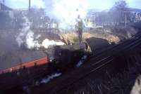 42060 emerging from the shadows of the cutting near Overlee Road, Clarkston, on 25 March 1964.<br><br>[John Robin 25/03/1964]