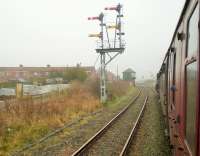 Fine double bracket signal at Marcheys House Junction on the line to Ashington. This view looking south towards the junction from <I>The Wansbeck</I> steam railtour that reversed here to take the left chord to Winning Junction and the Blyth Branch. On return the train took the direct route from Winning Junction to West Sleekburn Junction thus traversing all three sides of this triangle of freight only lines. <br><br>[Malcolm Chattwood 29/03/2014]