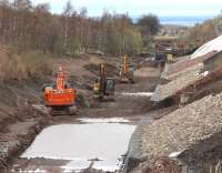 View north along the trackbed of the Borders Railway towards the site of Newtongrange station on Sunday 6 April 2014. The new station will be located just before the bridge carrying the A7. The Firth of Forth is visible in the background with the Kingdom of Fife beyond.<br><br>[John Furnevel 06/04/2014]