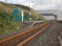 A view of the one carriage length Llanaber Halt looking towards Barmouth from the beach access boarded crossing on the north side of the halt in December 2011. The line and halt suffered extensive damage during the severe early 2014 storms affecting the Cambrian coast.<br><br>[David Pesterfield 07/12/2011]