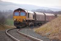 DBS 66100 grinds uphill towards Boig Road level crossing on 31 March 2014 with coal empties from Carlisle to Greenburn loading point. [Ref query 4651]<br><br>[Bill Roberton 31/03/2014]