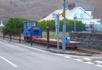 Hunslet built diesel loco and wagon on track replacement duty on the Fairbourne Railway alongside Beach Road on 7 December 2011.<br><br>[David Pesterfield 07/12/2011]