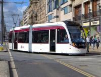 Tram 266 takes the curve from Princes Street into South St Andrew Street on 6 April.<br><br>[Bill Roberton 05/04/2014]