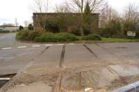 With the site of Long Marston station behind the camera, the rails in the road are a reminder of the former Stratford Upon Avon to Chelteham line. Half a mile beyond the building a single line to Honeybourne remains in use to serve the extensive former Army Depot now used to store rolling stock [see image 46703]. [Ref query 3902]<br><br>[John McIntyre 03/03/2014]