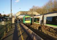London Midland services meet at Bromsgrove on 1 March 2014. On the left is a Hereford to New Street service and on the right New Street to Worcester, both operated by class 170 dmus.<br><br>[John McIntyre 01/03/2014]