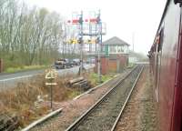 Winning Junction signal box, seen from <I>The Wansbeck</I> railtour on 29 March 2014. The right hand signals control the chord to Marcheys House Junction, where the train had just reversed. The left hand signals control the chord to West Sleekburn Junction, which the train would traverse on its return journey, before heading south to cover the Boulby line in North Yorkshire [see image 33493]. <br><br>[Malcolm Chattwood 29/03/2014]