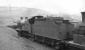 The scrap road at Eastfield shed in January 1962, featuring withdrawn class 2P 4-4-0 no 40566 standing at the end of the line. The locomotive was awaiting transfer to Cowlairs Works for disposal, which took place in October of that year.<br><br>[David Stewart 21/01/1962]