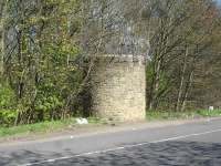 Unlike the original brick construction of what is believed to be the number 6 air shaft for the upside bore of Woolley tunnel the more northerly shaft, believed to be number 2, sited alongside the M1 entry slip road from Woolley Edge northbound services, is of stone construction, possibly having been rebuilt when the M1 was constructed in the late 1960s. A further stone built air shaft, believed to be number 5, for the downside bore, is sited just off the lorry parking area for the southbound services, just north of the Bramley Lane overbridge, whilst two further brick air shafts, numbers 7 & 8 have recently been located in dense woodland south of air shaft number 6 [see image 46840].  <br><br>[David Pesterfield 16/04/2014]