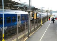 Looking east along the car park on the south side of Waverley station on 11 April, just as 380104 runs into platform 8 with the 11.27 ex-North Berwick. Already occupying the west end of the same platform is 334029 awaiting its departure time with the 12.07 for Milngavie. <br><br>[John Furnevel 11/04/2014]