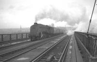 A foggy day on the Tyne, thought to be 25 May 1963. An unidentified A4 is approaching the Gateshead side of the King Edward Bridge shortly after leaving Newcastle Central with an up express passenger train.<br><br>[K A Gray 25/05/1963]
