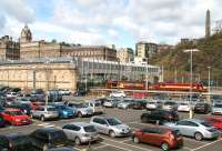 The east end of Waverley looking across the car park in the sunshine on 11 April 2014. The stabled sleeper locomotives are 67021 and 90039.<br><br>[John Furnevel 11/04/2014]