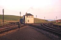 The photographers son strolls towards Riccarton South box on the occasion of a short camping holiday here in Spring 1966. The Waverley Route swings away to the right of the box while to the left is the headshunt survivor of the former Border Counties line to Hexham. <br><br>[Frank Spaven Collection (Courtesy David Spaven) //1966]