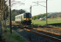 With the M6 motorway on the right, road traffic is unable to keep up with 350401 as it approaches Brock on 15 April 2014 with a service for Manchester Airport.<br><br>[John McIntyre 15/04/2014]