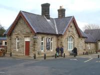 The frontage to the former Hawes Station main building, now part of the Dales Countryside Museum, seen on Easter Monday 2014. One ex BR Mk1 carriage of the display branch train, complete with loco, can be seen alongside the westbound platform.<br><br>[David Pesterfield 21/04/2014]