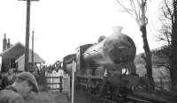 The SLS <I>Farwell to Peebles</I> railtour of 3 February 1962 photographed at Cardrona during a photostop. The locomotive is J37 0-6-0 no 64587. [See image 30217]<br><br>[David Stewart 03/02/1962]