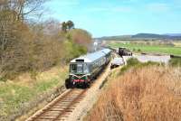 Over the Easter Weekend The Strathspey Railway ran extra trains using the DMU set, seen here leaving Broomhill for Aviemore on 19 April.<br><br>[John Gray 19/04/2014]