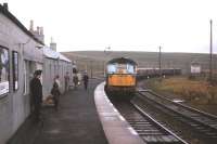 A Carlisle-Edinburgh train rolls into Riccarton Junction in September 1963. The photographer's two sons - with camping gear, after an idyllic holiday here - are just visible on the platform. <br><br>[Frank Spaven Collection (Courtesy David Spaven) /09/1963]