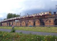 A westbound 6-car emu on Yorkhill viaduct on 23 April 2014 forming the 11.53 Motherwell - Milngavie service.<br><br>[Colin Miller 23/04/2014]