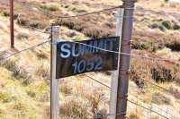 The trackbed of the line over Dava Moor has largely been incorporated into the Dava Way. Between Grantown-on-Spey and Dava the line climbed to a height of 1052 feet, a summit still marked by this (easily missed) sign. [See image 26650] <br><br>[John Gray 20/04/2014]